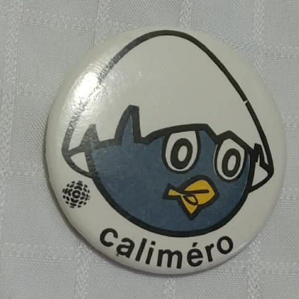 Strange & unusual vintage button pin featuring Caliméro